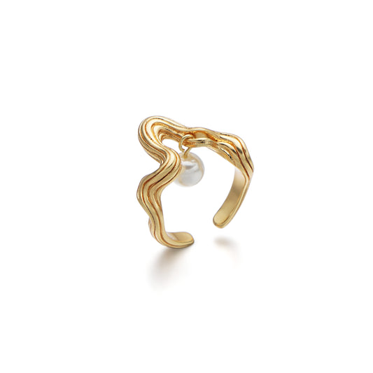 Alt Text: A visually poetic ring named "Pearl à Scadent," featuring a delicate pearl suspended from a textured tree branch-like ring band. The design symbolizes the harmonious balance between the desire for decadence and the grounding force of tradition, serving as a reminder of resilience, growth, and the unwavering ties to one's roots.